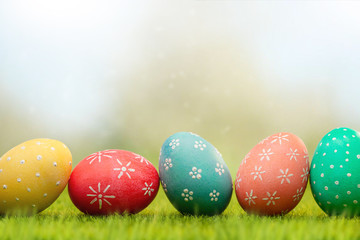 Easter screensaver, a row of Easter eggs on the green grass