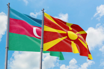 Macedonia and Azerbaijan flags waving in the wind against white cloudy blue sky together. Diplomacy concept, international relations.