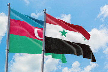 Syria and Azerbaijan flags waving in the wind against white cloudy blue sky together. Diplomacy...