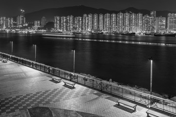Seaside Promenade and skyline of Harbor in Hong Kong city at night