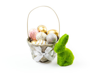 Fototapeta premium Happy Easter golden shine decorated eggs in basket isolated on white background. For greeting card, promotion, poster, flyer, web-banner, article
