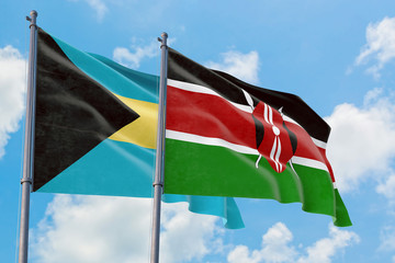 Kenya and Bahamas flags waving in the wind against white cloudy blue sky together. Diplomacy concept, international relations.