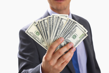 Man in suit and tie hold in arm pack of hundred dollar bills closeup. Stock market exchange earn pile rich present gift employer prepayment service gratitude concept