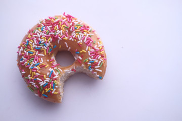 close up of donut with mouth bite 