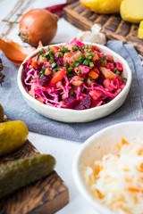 Vinegret or vinaigrette Russian red salad with cooked and pickled vegetables, peas, beetroot. Vegan healthy dietary food