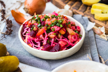 Vinegret or vinaigrette Russian red salad with cooked and pickled vegetables, peas, beetroot. Vegan healthy dietary food