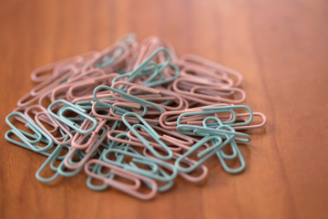 close-up paperclips on wooden desk