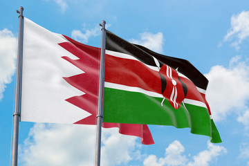 Kenya and Bahrain flags waving in the wind against white cloudy blue sky together. Diplomacy concept, international relations.