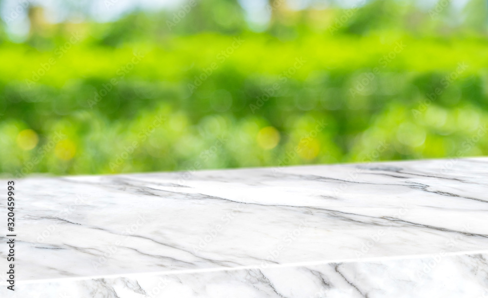 Poster spring background.empty diagonal white mable table with blur tree in garden boekh background,banner 