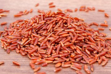 Brown rice on rustic board, healthy nutrition