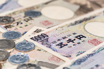 Obraz na płótnie Canvas Close up japanese currency yen money banknote and coin. Background concept for japan economy.