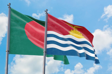Kiribati and Bangladesh flags waving in the wind against white cloudy blue sky together. Diplomacy concept, international relations.