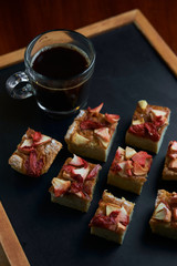 Fruit cake with cup of black coffee