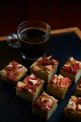 Fruit cake with cup of black coffee