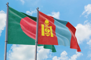 Mongolia and Bangladesh flags waving in the wind against white cloudy blue sky together. Diplomacy concept, international relations.