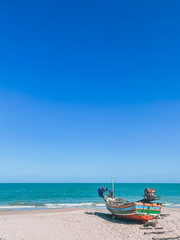 Naklejka na ściany i meble Beautiful view fishing boat on the beach tropical island seascape backgrounds