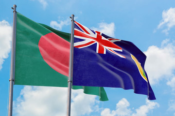 Turks And Caicos Islands and Bangladesh flags waving in the wind against white cloudy blue sky together. Diplomacy concept, international relations.