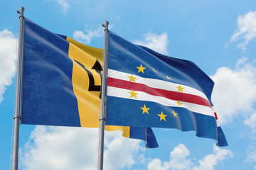 Cape Verde and Barbados flags waving in the wind against white cloudy blue sky together. Diplomacy concept, international relations.