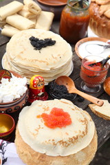 Still life with pancakes and red caviar