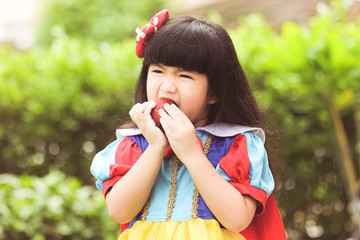 Little girl snow white with apple,Snow White's lovely.