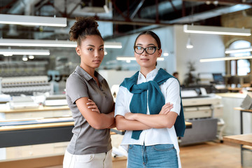 Be an expert, not an introvert. Female co-workers posing in office