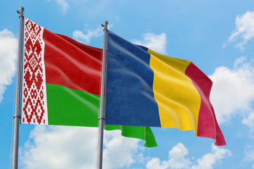 Chad and Belarus flags waving in the wind against white cloudy blue sky together. Diplomacy concept, international relations.