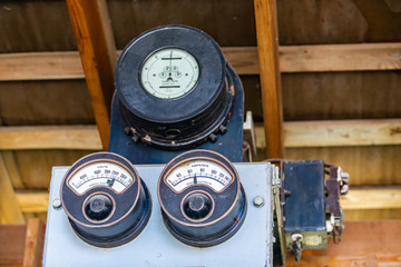 One of the first electricity measuring instruments. Old early 20th century ampere and volt meter in the museum, Kootenays, British Columbia, Canada