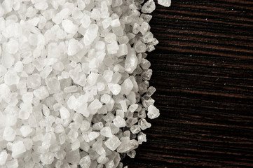Sea salt on wooden background