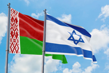 Fototapeta na wymiar Israel and Belarus flags waving in the wind against white cloudy blue sky together. Diplomacy concept, international relations.