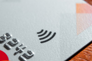 Contactless credit card sign close-up, soft focus. New technologies, EMV chip card, smart payment...