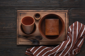 Pottery and wooden utensils, kitchen napkin. Rustic style