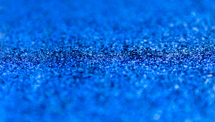 Blur blue sparkle background. Defocused glitter texture