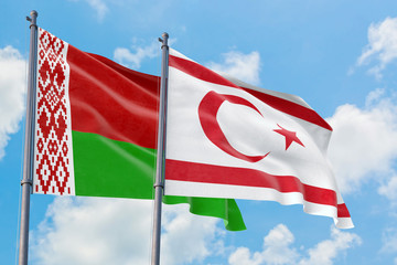 Northern Cyprus and Belarus flags waving in the wind against white cloudy blue sky together. Diplomacy concept, international relations.