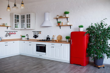 Modern Kitchen Interior with Island, Sink, Cabinets, and Big Window in New Luxury Home.