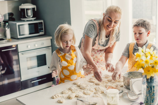 Mom Cooking With Kids On The Kitchen