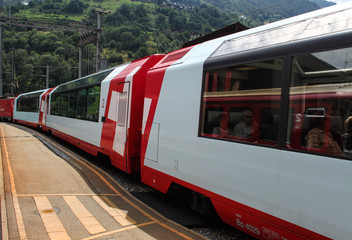 Obraz premium Glacier Express scenic train is the famous scenic train link between St-Moritz and Zermatt