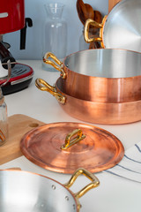 Close up of modern kitchen interior with copper cookware