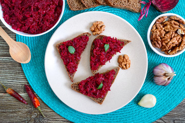 Beetroot caviar. Simple, tasty and healthy vegetable snack. Sliced rye bread with beetroot caviar. Lenten menu. Top view.