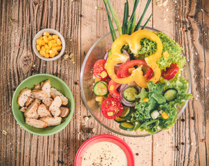 Mixed salad - vegetable on wooden table