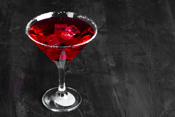 Beautiful alciohol cocktail on dark stone table
