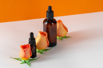 Cosmetics containers decorated with orange rose petals