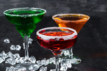 Beautiful alciohol cocktail on dark stone table