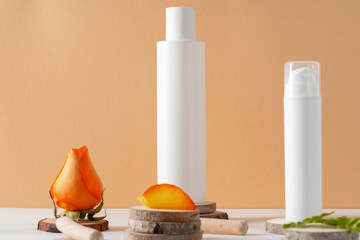 Cosmetics containers decorated with orange rose petals