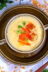 Pea porridge on a wooden table