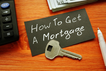 Text sign showing hand written words how to get a mortgage