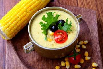 Corn porridge on wooden background