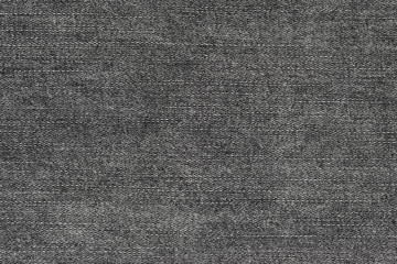 Black natural texture of knitted wool textile material background. dark gray cotton fabric woven canvas texture