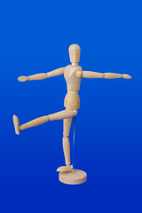 Sports wooden toy figure on blue