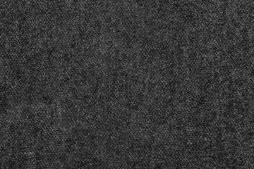 Black natural texture of knitted wool textile material background. dark gray cotton fabric woven canvas texture