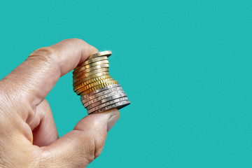 Coin stack between fingers